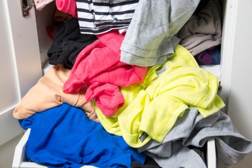 Operatives wearing PPE preparing to place a skip